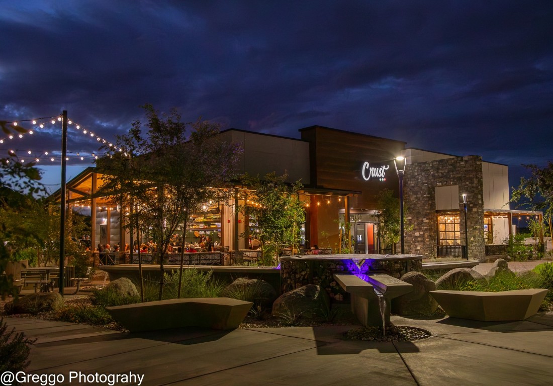 Trailhead Retail restaurant and courtyard area at night